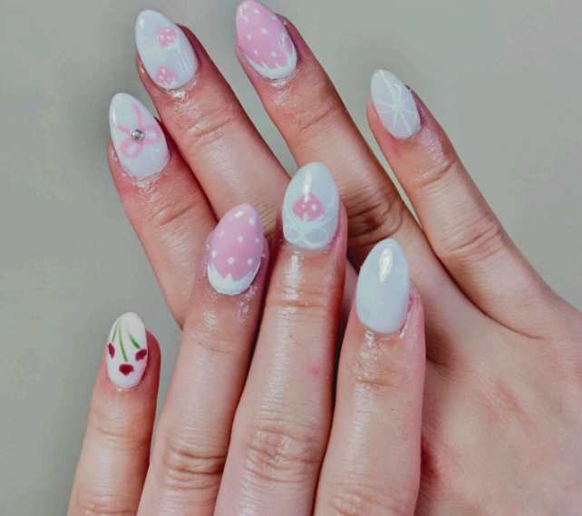 Pastel pink and mint nails with delicate floral and dot art