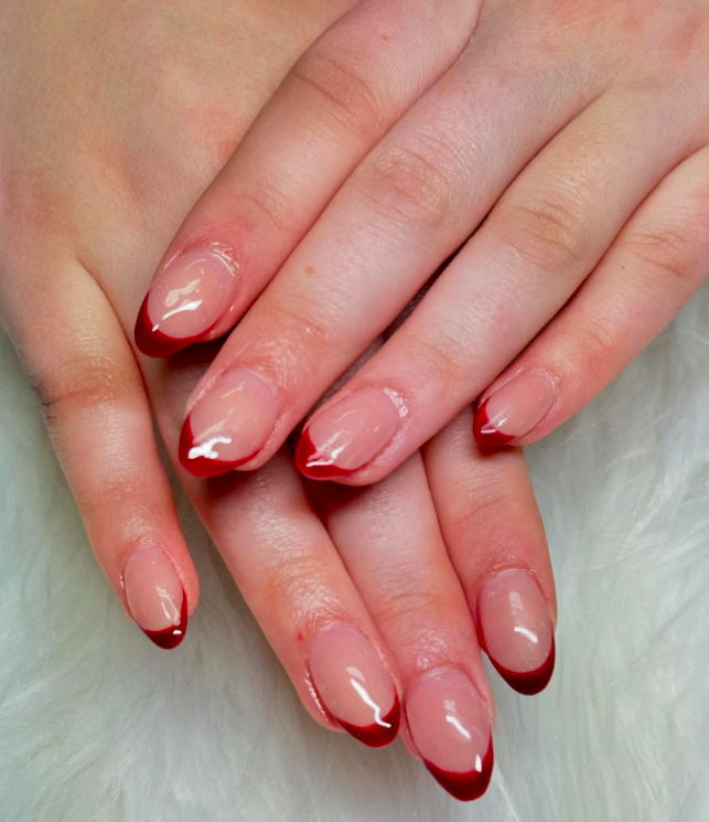 Almond nails with glossy ruby red French tips
